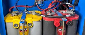 Yellow and red batteries connected by wires